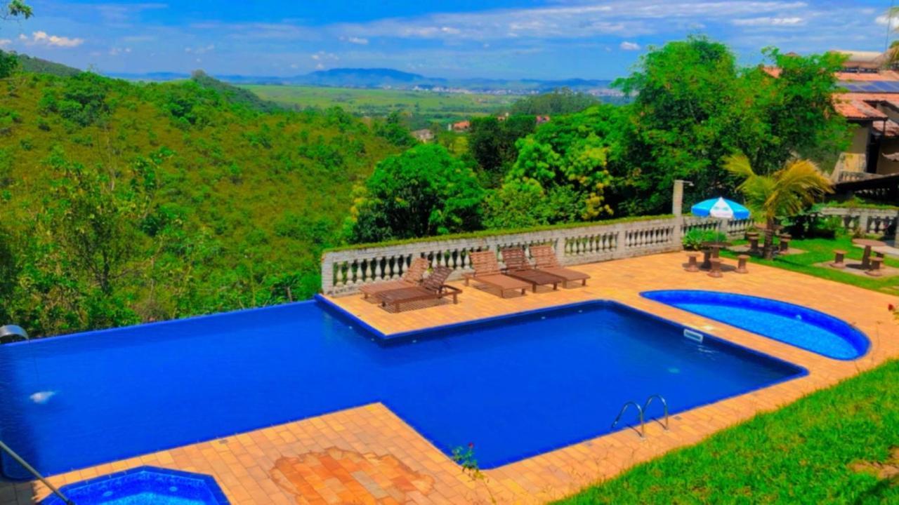 Pousada Nossa Senhora Penedo  Εξωτερικό φωτογραφία View of the swimming pool at the hotel