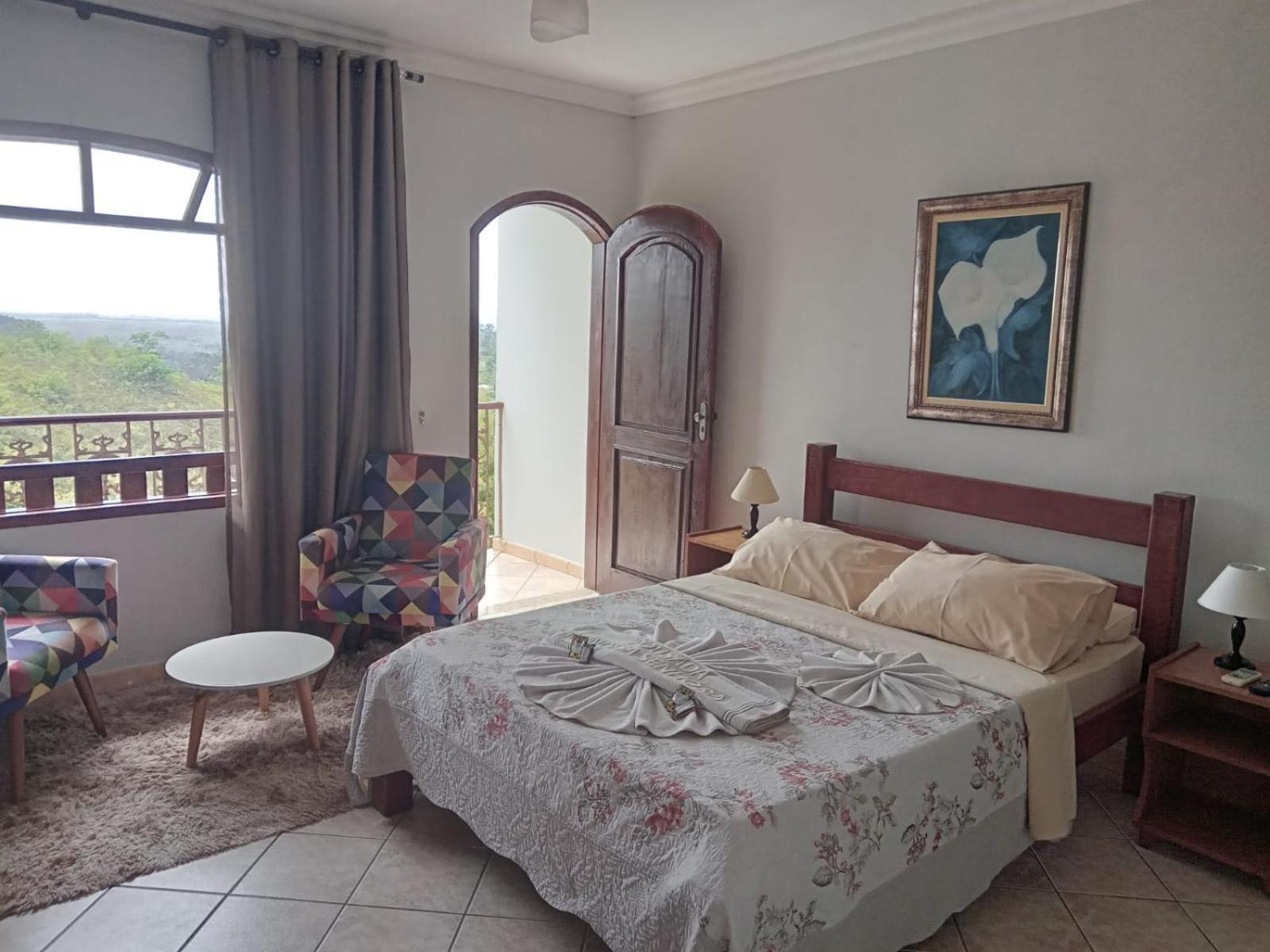 Pousada Nossa Senhora Penedo  Δωμάτιο φωτογραφία A bedroom in a hotel